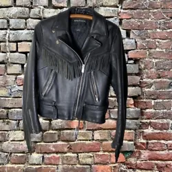 Rev up your biker style with this vintage Harley Davidson motorcycle jacket. Crafted from durable leather and adorned...