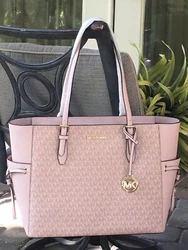 Beautiful MK Signature in Dark Powder Blush with leather Trim and Accents. Mk hanging charm. Interior has MK signature...