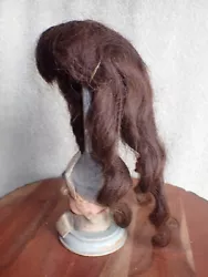 This is a beautiful antique brunette human hair doll wig. It does shed. The curls are nice here.
