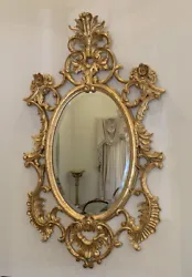 Magnificent ornate Harrison & Gil Dauphine Hand Carved Gilt Baroque Oval Mirror. Marked with the Dauphine Harrison &...