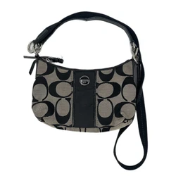Step into any season in style with this chic Coach Black Convertible Shoulder Bag. Perfect for the woman on the go,...