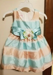 Dress has a sheer white lining on the full dress as well as another layer (petticoat) from the waist down.