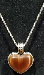 I know the chain is sterling but, the charm is not marked. I dont believe the stone is a real gem. It may be glass?....