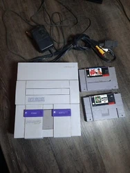 Super Nintendo SNES Home Console - White/Gray Tested. some scratches from use and light discoloration from age. No...