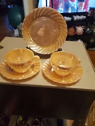 This set has 2 cups and saucers plus 1 bread and butter plate. Its such a nice shiny peach lustre. They are thinner and...