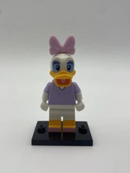 LEGO Disney Daisy Duck Minifigure (#71012) Disney Minifigure Series. Condition is “Used”. Comes with Minifigure and...