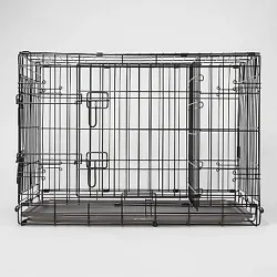 •Black fence-style dog crate is great for home or travel •Collapsible design folds flat for easy storage •Plastic...