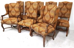 Includes 2 wingback armchairs and 6 side chairs featuring hand carved features and French nail trim. Side Chairs. 21