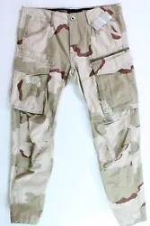 Allover camo print. Two hand pockets, two flap pockets at back, two cargo pockets at sides, zip pocket at left leg....