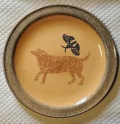 Labrador Dog and Butterfly design- there are a few minor scratches. Yellow/gold Stoneware with blue and brown design....