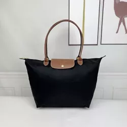 The bag is a long handle tote bag. Nylon; trims: leather. Top zip closure. Large/1899 Opening: 46CM length:31CM...