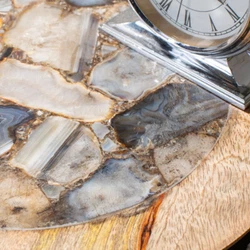 Bring the striking beauty of nature indoors with this spellbinding Lumi Accent Table. Sitting atop sleek black metal...