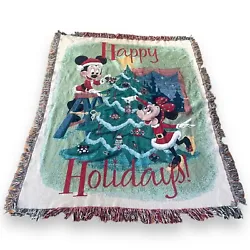Get into the holiday spirit with this Disney Parks Mickey and Minnie Santa Tree woven tapestry throw blanket. The...