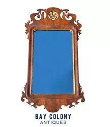 20TH CENTURY CHIPPENDALE ANTIQUE STYLE MAHOGANY WALL MIRROR WITH GILDED ACCENTS & TREFOIL CARVED CREST. The crest is...