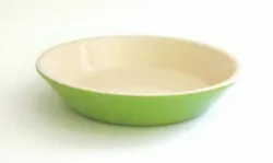 Solid light green color similar to kiwi but not graded. Le Creuset Poterie line of bakeware.