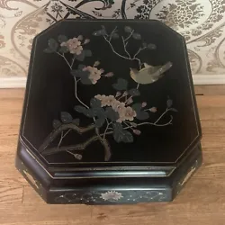 1970s vintage chinoiserie-style black laquered drum table. Made of wood throughout with plastic overlay into which the...