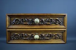 Amazing Pair of walnut drawer fronts, hand-carved. They date from the 19th century. Decorated with foliage and a brass...