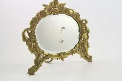 Very ornate with a cherub motif. Antique Victorian National Brass & Iron Works vanity tabletop mirror. Has an old...