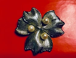 It is so sparkly and very sophisticated looking pin/Brooch. The photos are showing dark background, but the pin is...