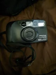 Capture moments in style with this Pentax IQZoom EZY 35mm point and shoot film camera. Its sleek and compact design...