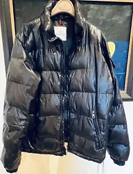 used Authentic Moncler men puffer coat for sale in a size 3 or M. Zipper lost handlers, still functional. There are two...