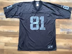 vintage Tim brown Oakland Raiders football jersey puma XL. Good vintage condition with graphic wear please see the...
