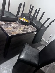 Condition is Used. 2 wobbly feet under table and 1 chair has a wobbly leg.