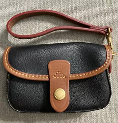 Vintage Dooney And Bourke Wristlet. Very good condition looks new
