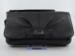 This pretty black leather wristlet/clutch from Coach is in very good condition with mild preowned wear.