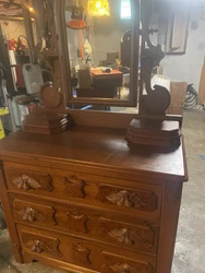 This antique Eastlake chest of drawers is a beautiful addition to any vintage furniture collection. The rich brown...