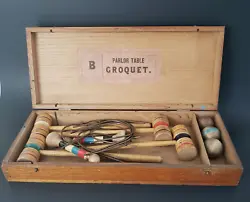 Parlor Table Croquet. pre-owned condition consistent with age and use, missing one ball, discoloration, wood split in...