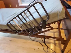 Adjustable twin bed frame with mattress and rails. Only used for 6 months. $850 new selling for $600.