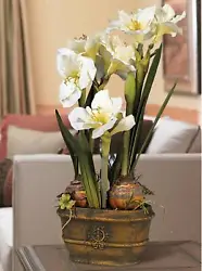 This faux version features fabric flowers and bulbs set in a verde green finish ceramic oval pot. Flowers are crafted...