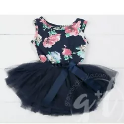Premium weight cotton/spandex sleeveless dress has an attached extra-full tulle tutu with a waist bow of crisp pink...