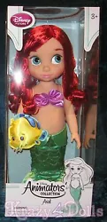 Part of the Disney Animators Collection. Ariel wears a satin seashell top.