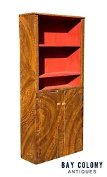 The cabinet has a salmon milk paint interior with two shelves in the upper cabinet and two shelves concealed in the...