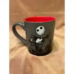 Mug is a dark gray & black with red inside cup, features, the Disneys beloved character from the Nightmare Before...