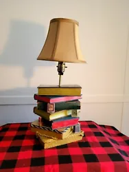 One of a kind book lamp made from real antique books. The lamp has been sealed with mod podge and then seven coats of...
