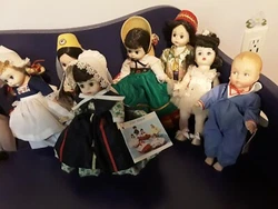 The lot includes 11 dolls Scarlett white dress. Little Sir Genius(rubber not hard plastic).