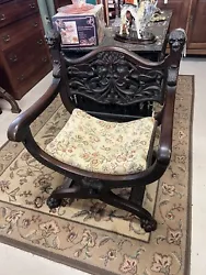 This antique chair from the Renaissance Revival period is made of beautiful mahogany wood and features intricate...