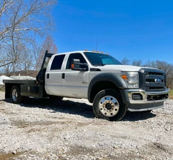 New motor with 100 miles on it. Runs great starts right up but has white smoke when it warms up out of the exhaust and...