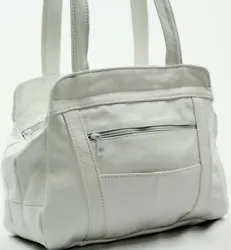 Made of soft white cowhide USA leather. Zipped pocket and open pocket on the exterior front & back. Double shoulder...