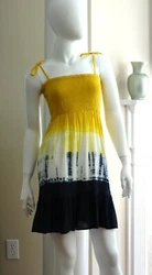 It is constructed with woven fabric in a tri-color tie dye finish. There are hidden pockets at the side seam and the...