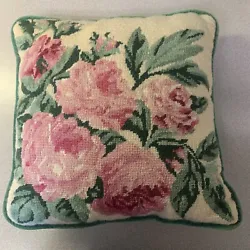 Pretty needlepoint pillow in great condition. Pink cabbage roses with green foliage- green velvet back. Measures 13x13...