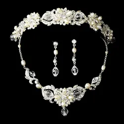 Glamorous and sensational, this bridal set features ivory freshwater pearls, clear rhinestones, and Swarovski crystals....