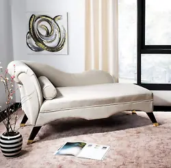 Upholstered in a luxe tan hue, its seductive curves, gold cap legs and posh pillow make it a must-have for designers....