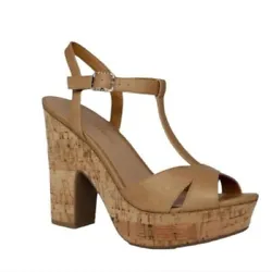 Give your favorite looks a retro lift in the wood-like platform heel and vintage-inspired T-strap profile of the...