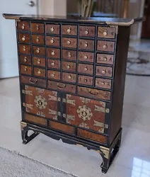 It has 37 drawers in total. however surprisingly TWO of these drawers are very well hidden behind two sliding wood...