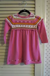 This is a sweet little dress, size 3T. It is pink with a Fair Isle style top with stripes of pink, white, purple,...