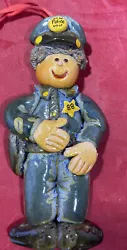This vintage 1988 dough police officer Christmas tree ornament is the perfect addition to any holiday collection. With...
